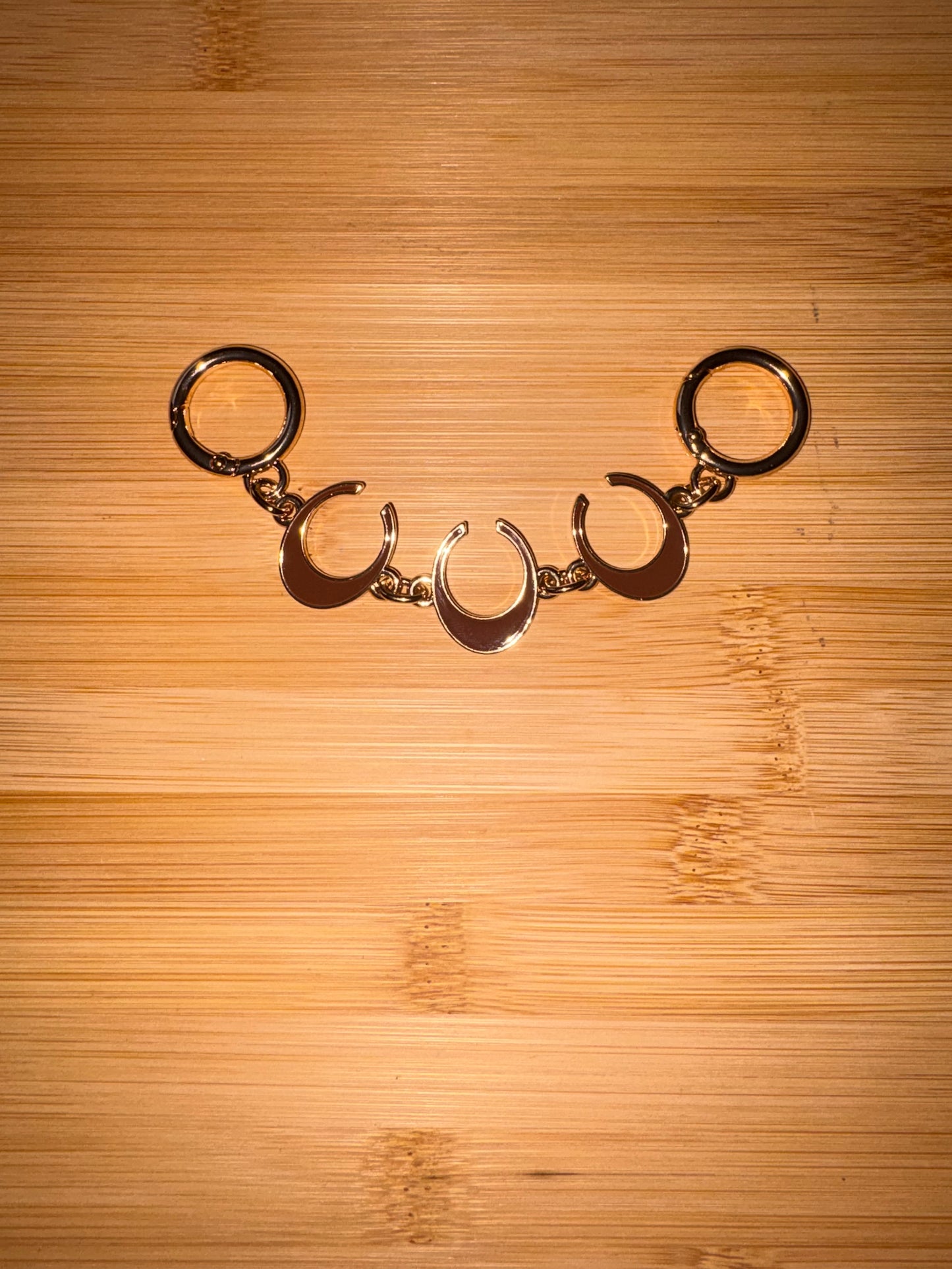 Gold and Brown “C” purse charm.