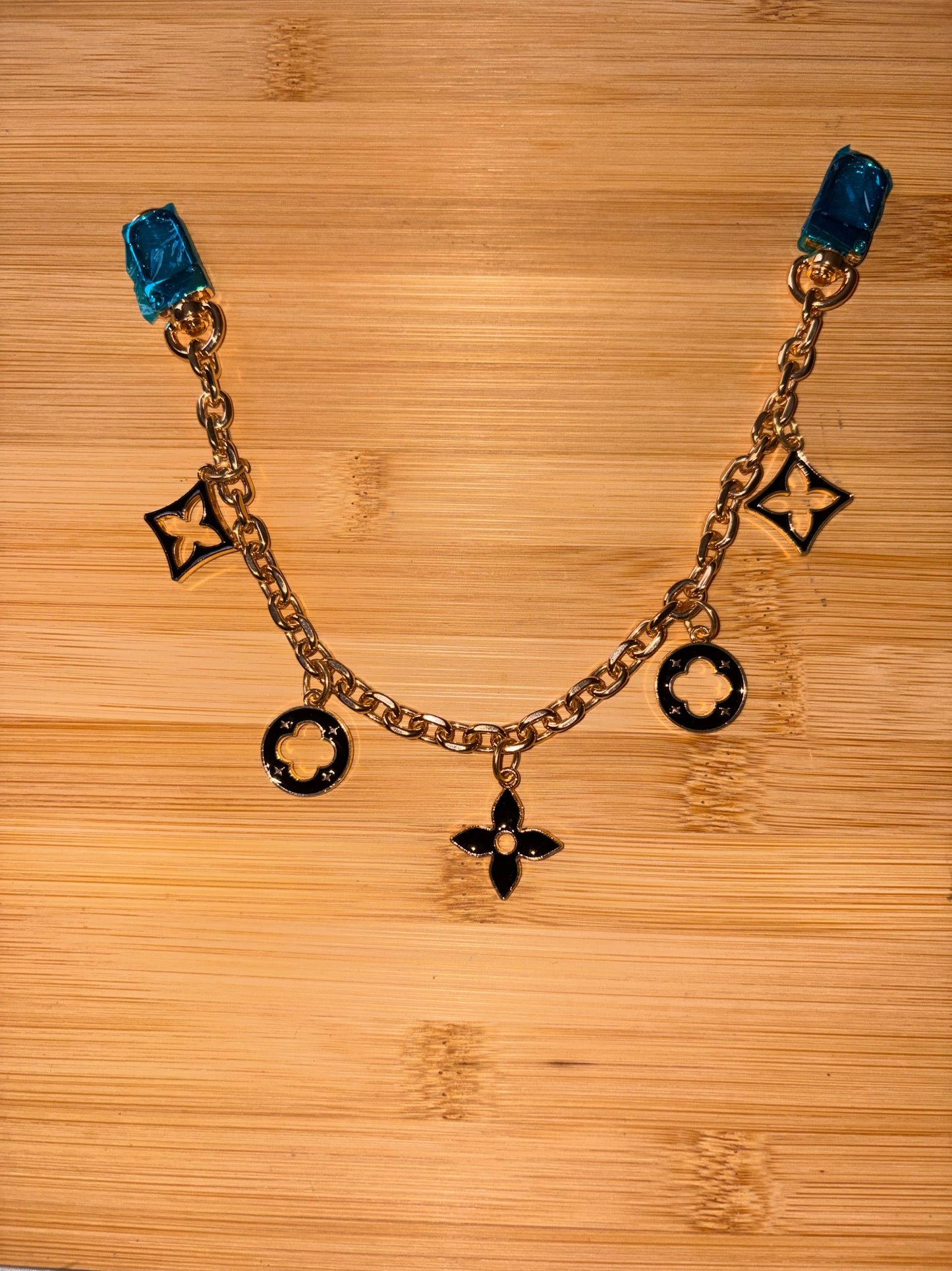 Black and Gold “LV” purse charm