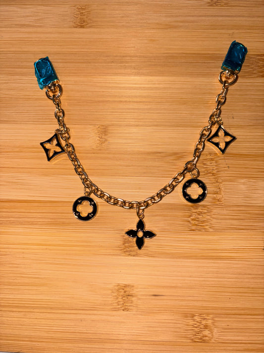 Black and Gold “LV” purse charm
